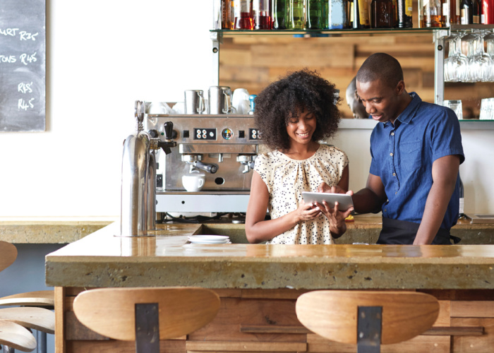 woman and man sitting at desk