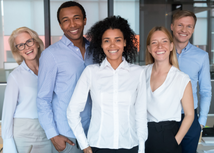 Group of employees smiling.